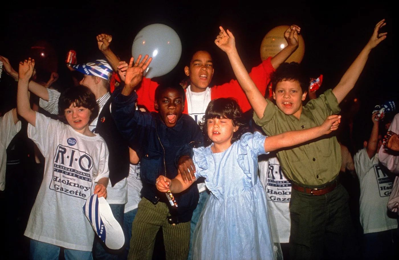 Children cheering at the Rio Saturday Club in October 1988